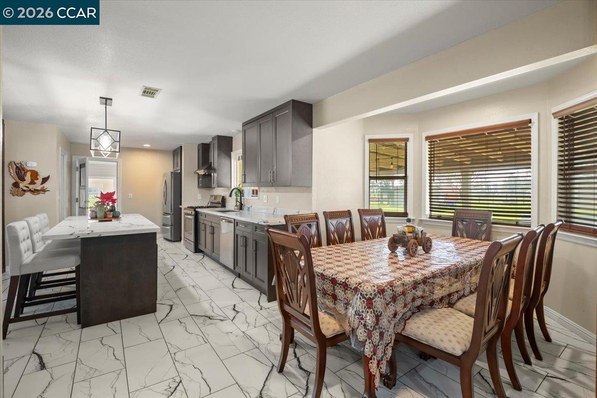 24685 Fuhrman Road Acampo, CA 95220 - Photo 23 of 58 a view of a dining room with furniture