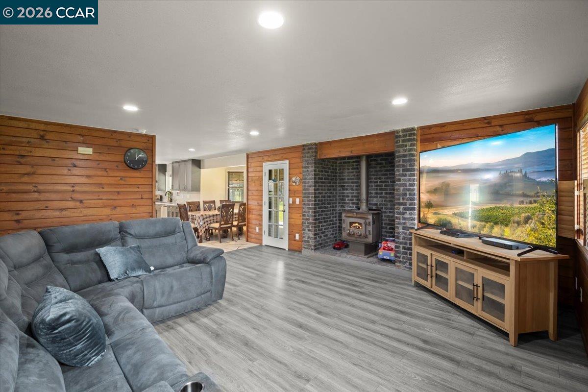 24685 Fuhrman Road Acampo, CA 95220 - Photo 25 of 58 a living room with furniture and a flat screen tv