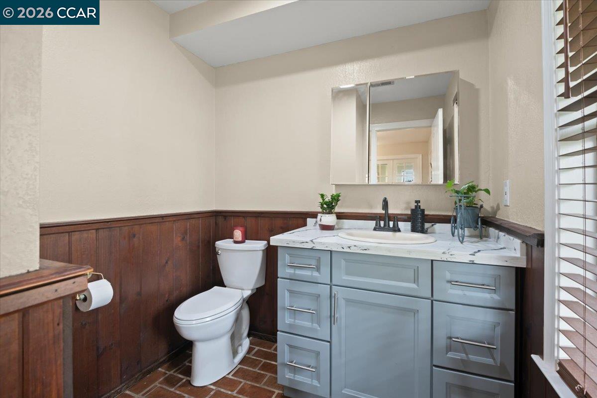 24685 Fuhrman Road Acampo, CA 95220 - Photo 26 of 58 a bathroom with a granite countertop toilet sink and mirror