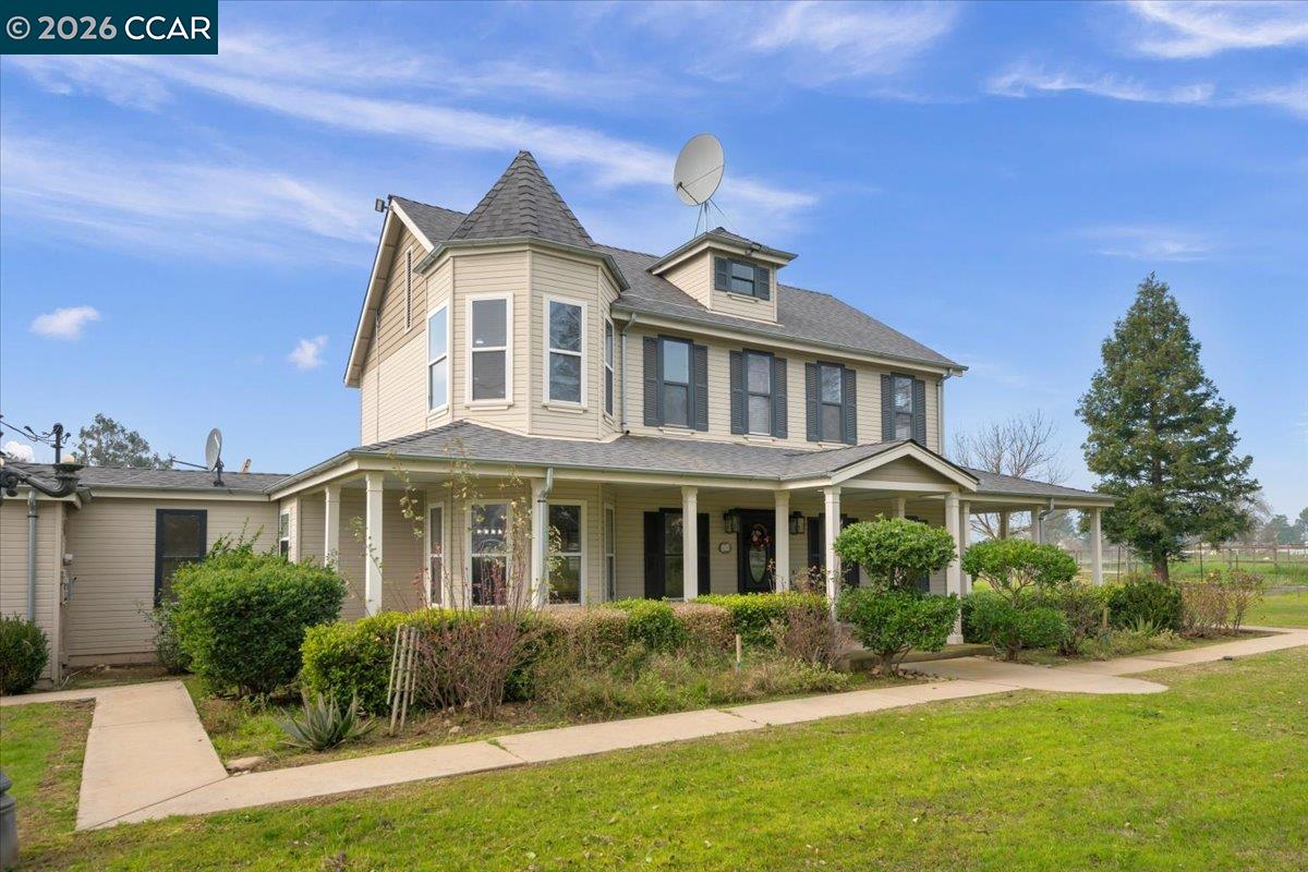 24685 Fuhrman Road Acampo, CA 95220 - Photo 3 of 58 a front view of a house with a yard