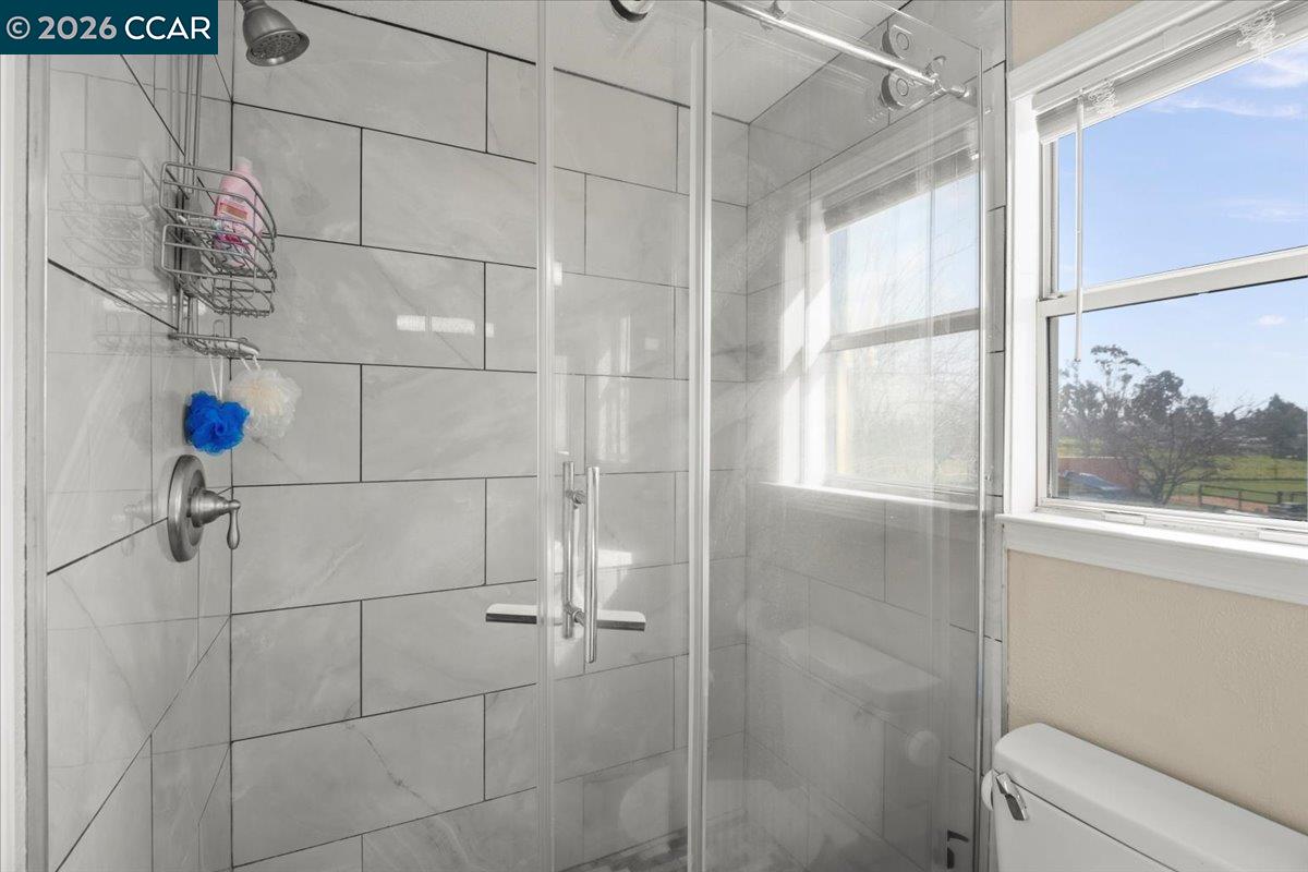 24685 Fuhrman Road Acampo, CA 95220 - Photo 33 of 58 a bathroom with a window and shower