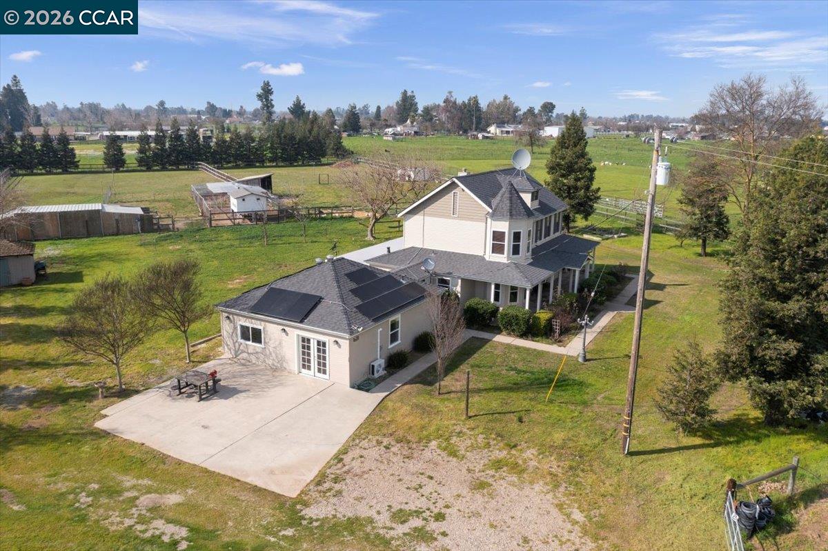 24685 Fuhrman Road Acampo, CA 95220 - Photo 34 of 58 a house with green field in front of it
