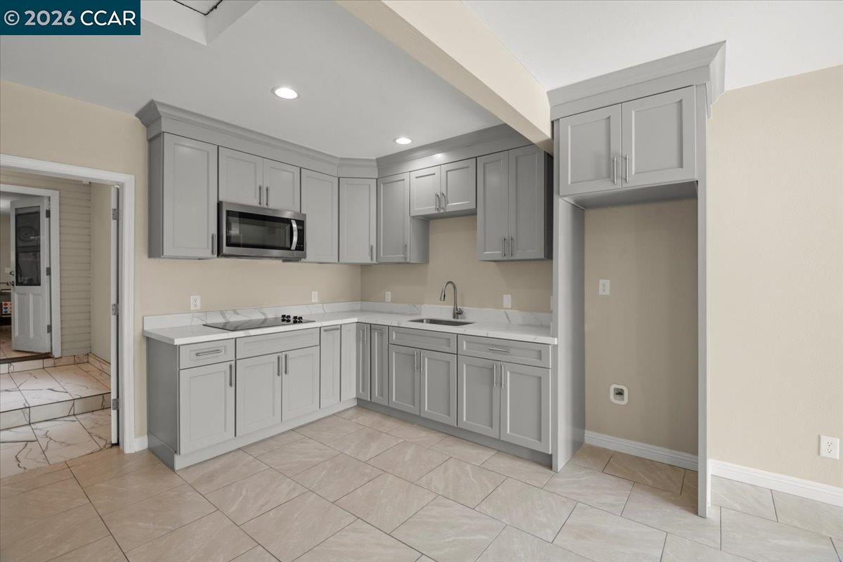 24685 Fuhrman Road Acampo, CA 95220 - Photo 37 of 58 a kitchen with cabinets and sink