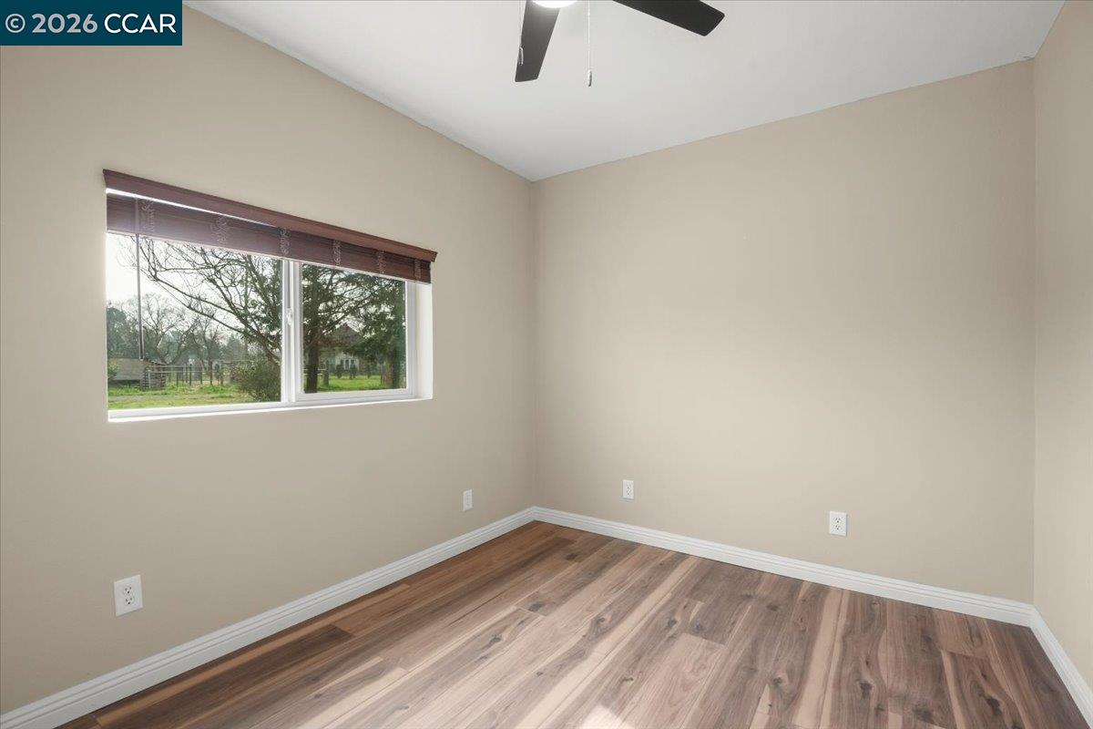 24685 Fuhrman Road Acampo, CA 95220 - Photo 38 of 58 an empty room with a window