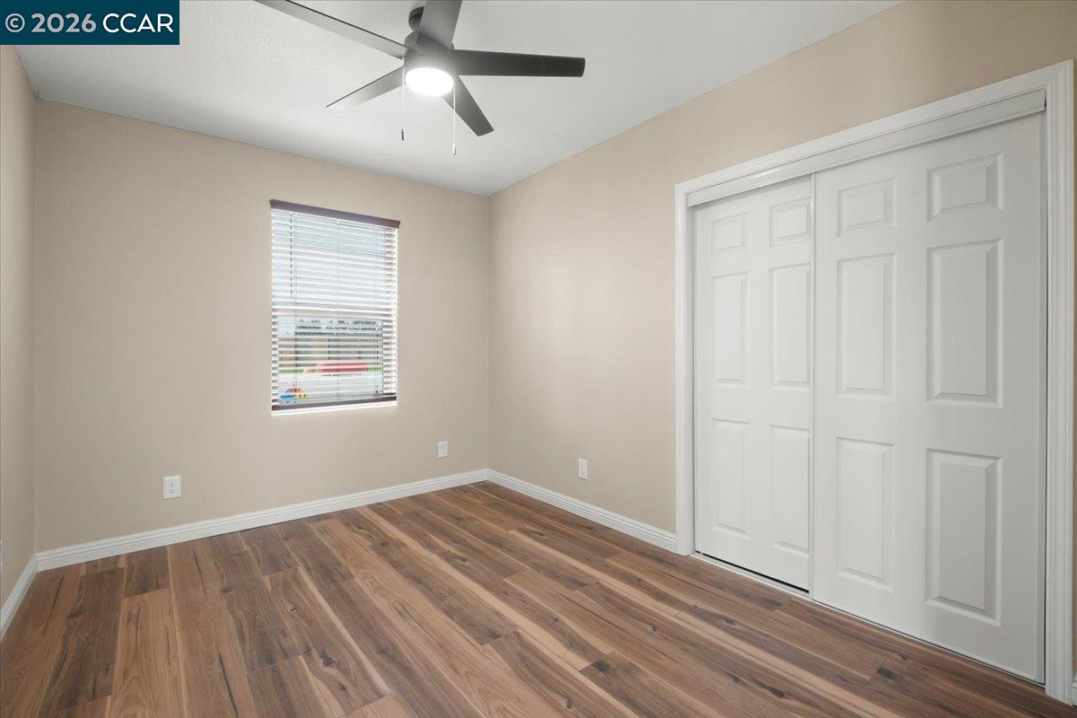 24685 Fuhrman Road Acampo, CA 95220 - Photo 39 of 58 a view of empty room with wooden floor and fan