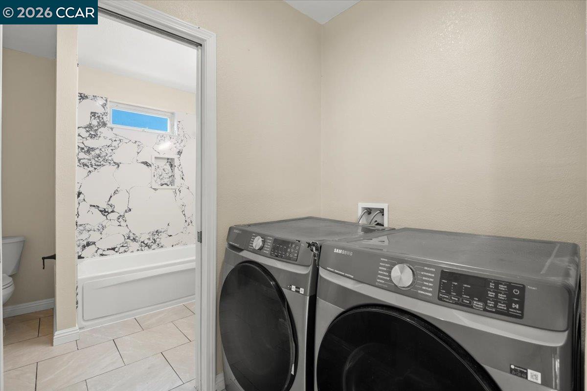 24685 Fuhrman Road Acampo, CA 95220 - Photo 40 of 58 a utility room with dryer and washer
