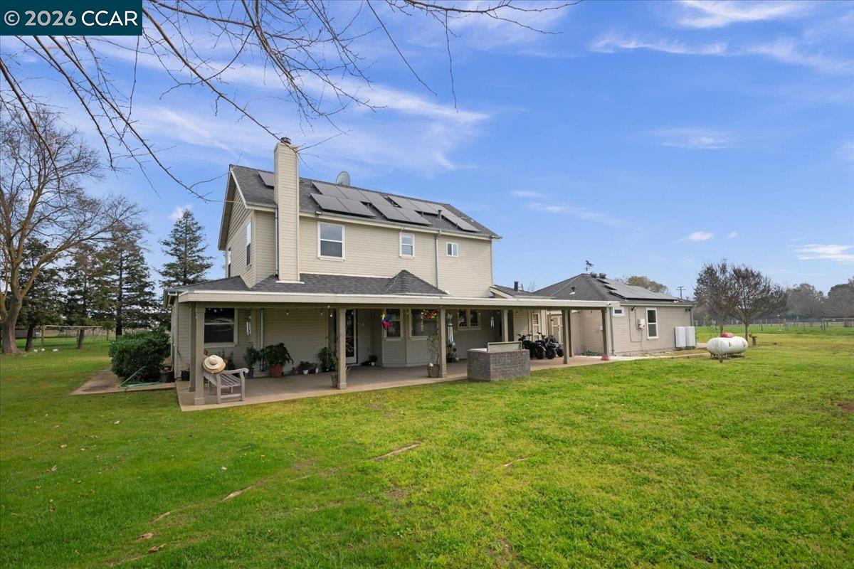 24685 Fuhrman Road Acampo, CA 95220 - Photo 43 of 58 a view of a house with a big yard and large trees