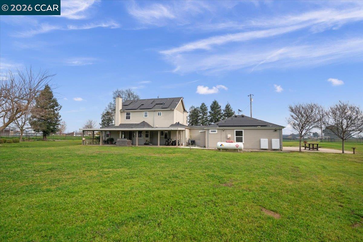24685 Fuhrman Road Acampo, CA 95220 - Photo 44 of 58 a view of a big house with a big yard and large trees