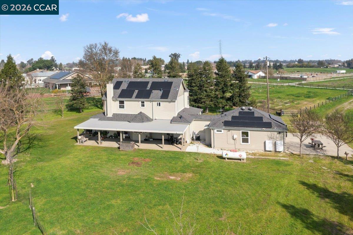 24685 Fuhrman Road Acampo, CA 95220 - Photo 46 of 58 a white house with a big yard and large trees