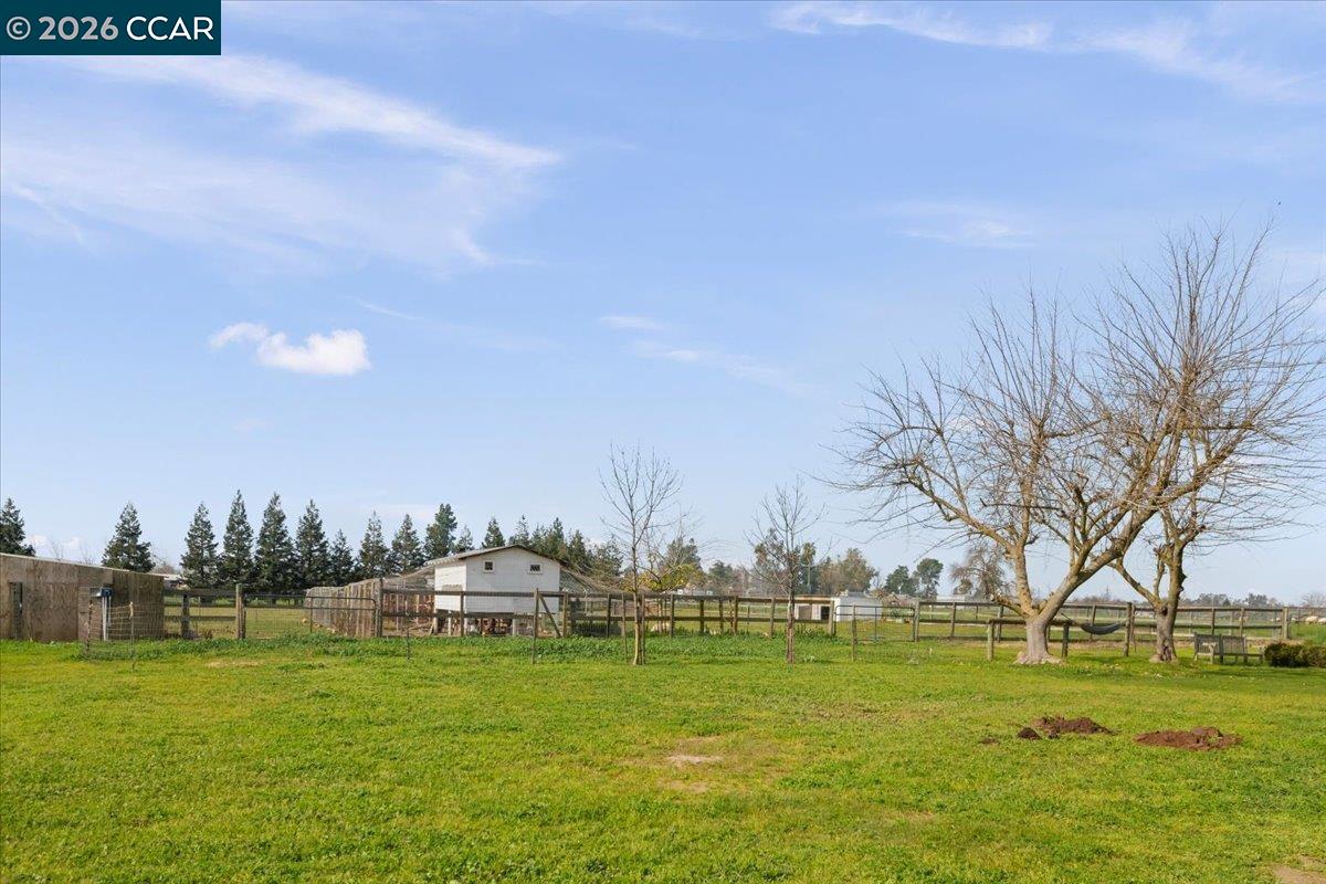 24685 Fuhrman Road Acampo, CA 95220 - Photo 48 of 58 a swimming pool with trees in the background