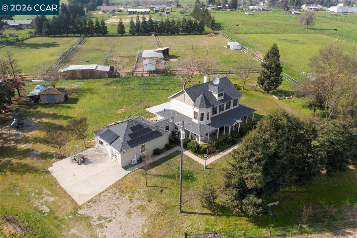 24685 Fuhrman Road Acampo, CA 95220 - Photo 7 of 58 a view of a lake with a house in the background