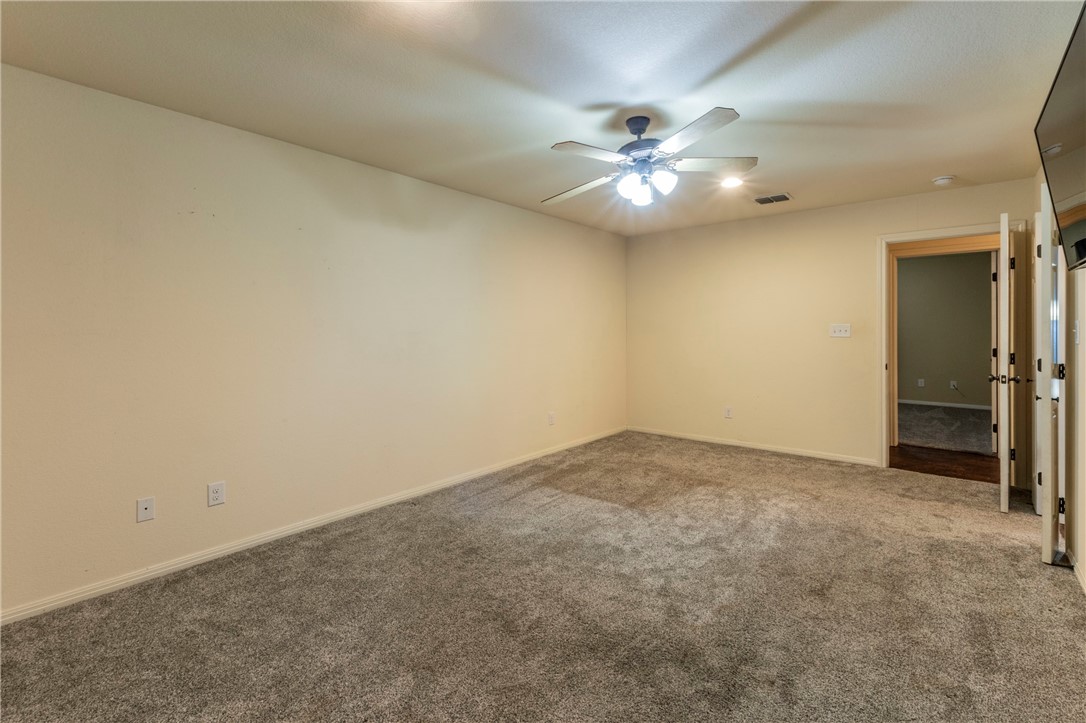 1203 Ave B Waco, TX 76705 - Photo 16 of 32 an empty room with closet and fan