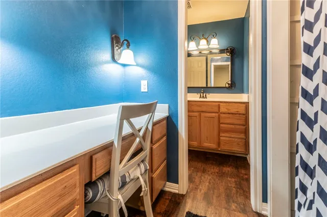 a view of a hallway with entryway wooden floor and front door