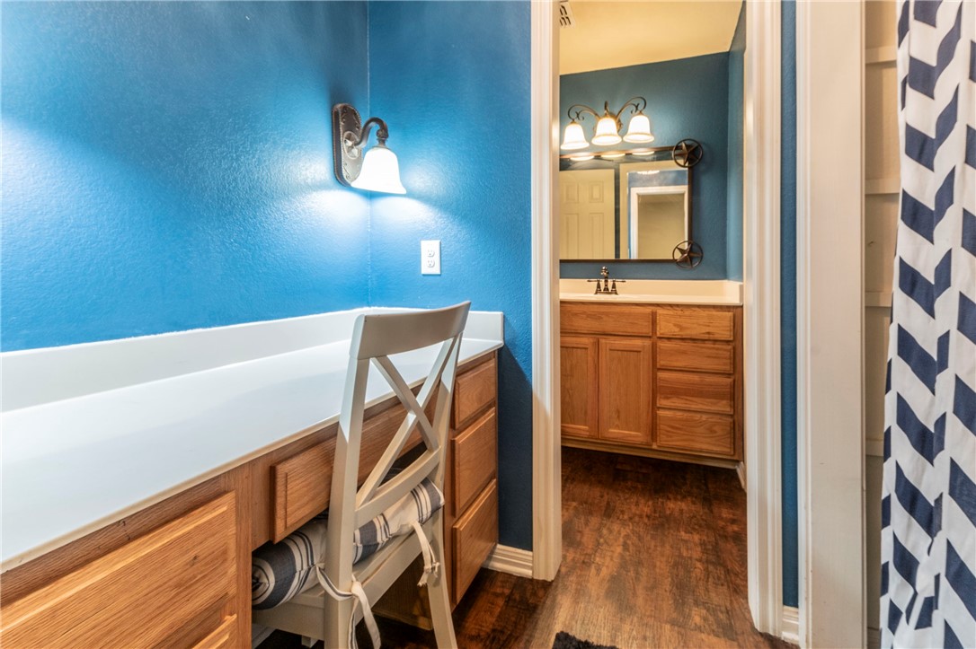1203 Ave B Waco, TX 76705 - Photo 17 of 32 a view of a hallway with entryway wooden floor and front door