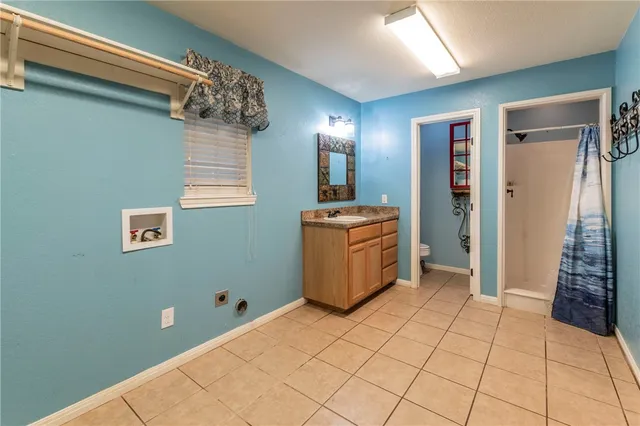 a view of a kitchen with utility area