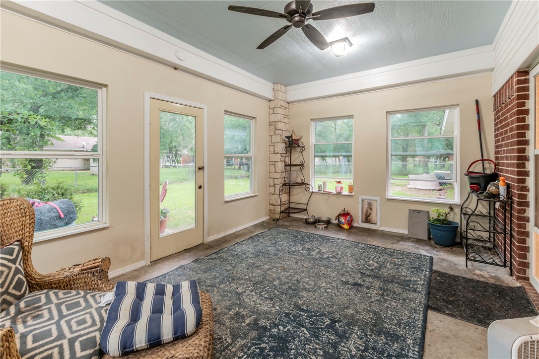 1203 Ave B Waco, TX 76705 - Photo 27 of 32 a living room with furniture and large windows