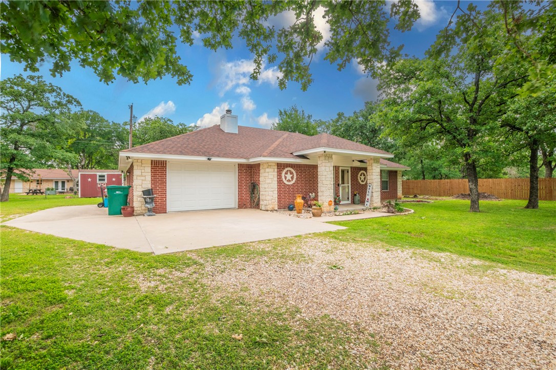 1203 Ave B Waco, TX 76705 - Photo 28 of 32 a front view of a house with a yard and garage