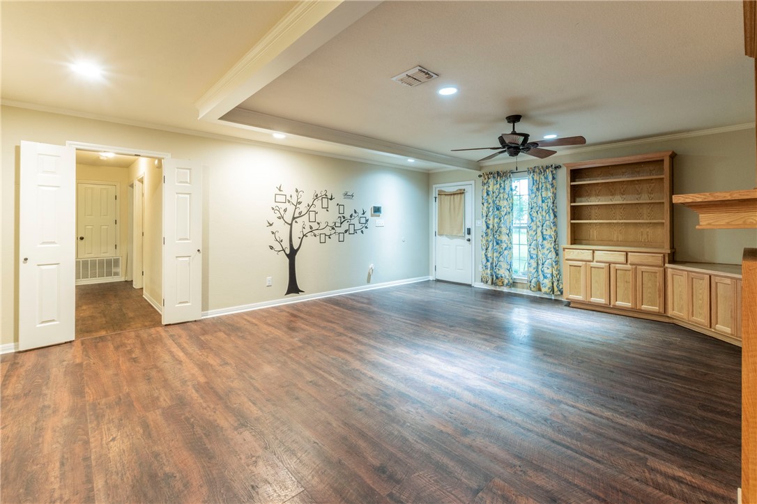 1203 Ave B Waco, TX 76705 - Photo 3 of 32 a view of empty room with wooden floor