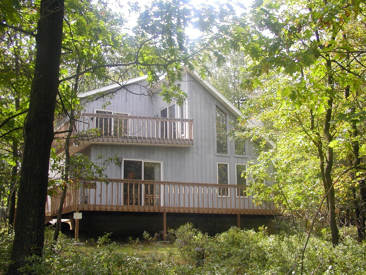 20 Brier Crest Road Blakeslee, PA 18610 - Photo 3 of 4 a view of a house with a wooden deck and a large tree