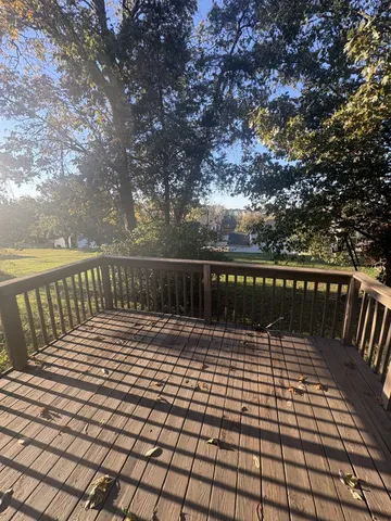 a view of deck with wooden floor and fence
