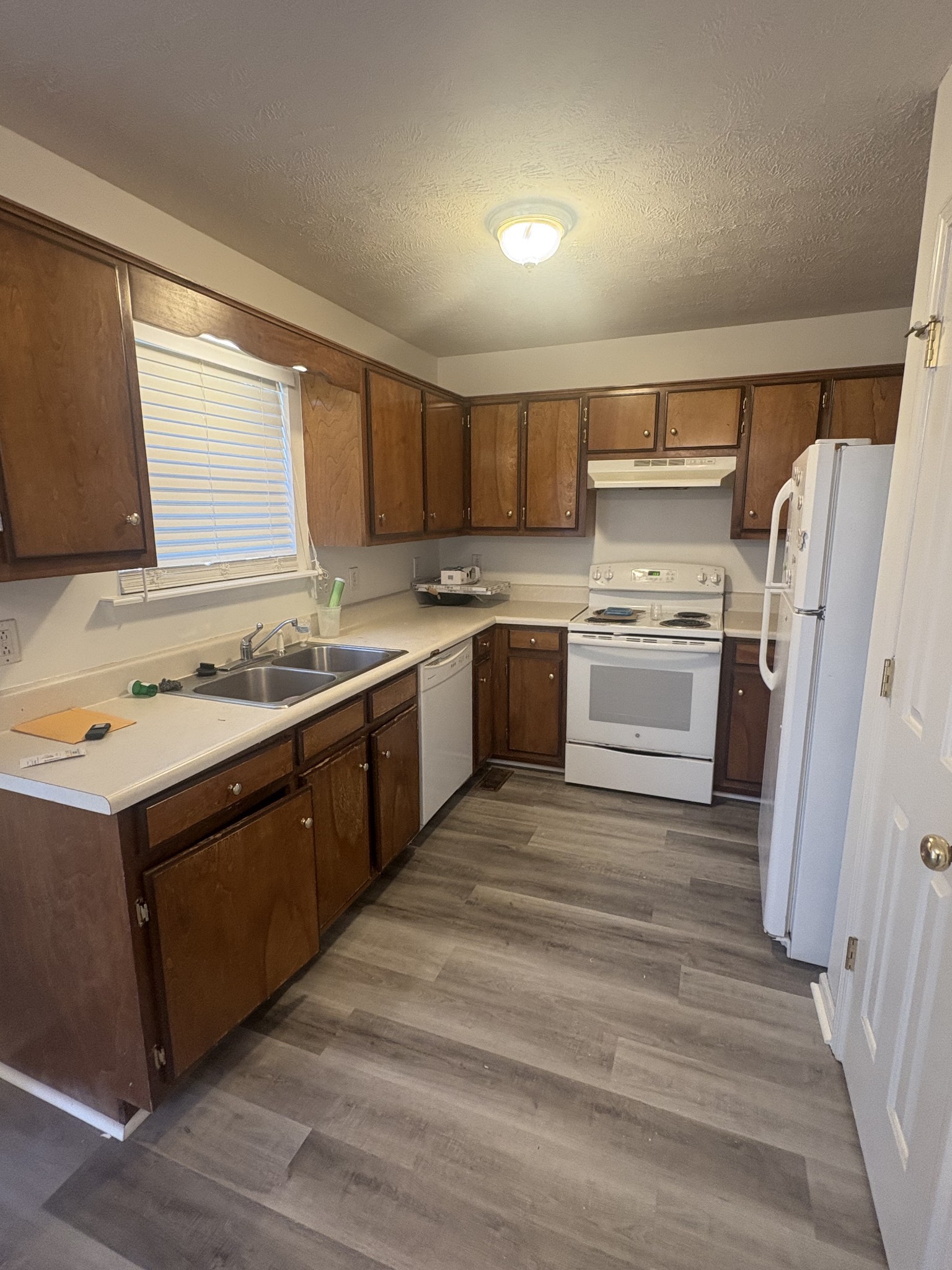 7165 Legacy Drive Antioch, TN 37013 - Photo 4 of 14 a kitchen with a sink stove and refrigerator