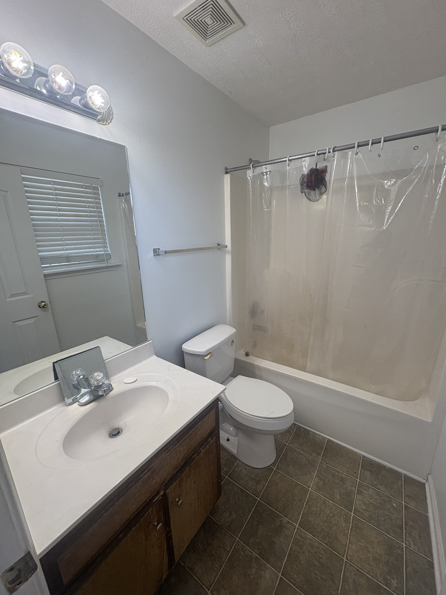 7165 Legacy Drive Antioch, TN 37013 - Photo 8 of 14 a bathroom with a sink toilet and shower
