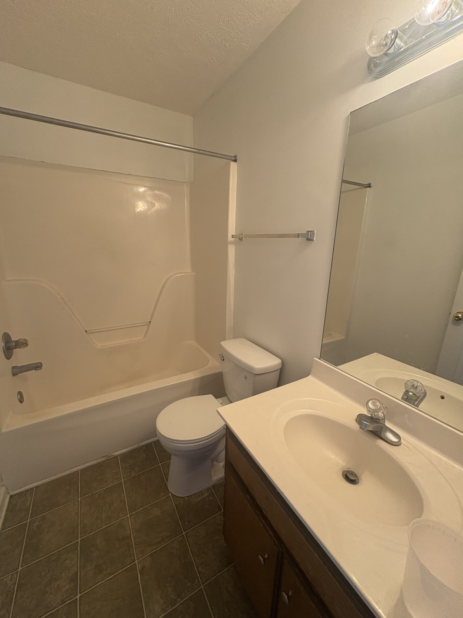 7165 Legacy Drive Antioch, TN 37013 - Photo 9 of 14 a bathroom with a sink a toilet and shower