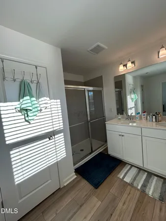a bathroom with a sink and mirror