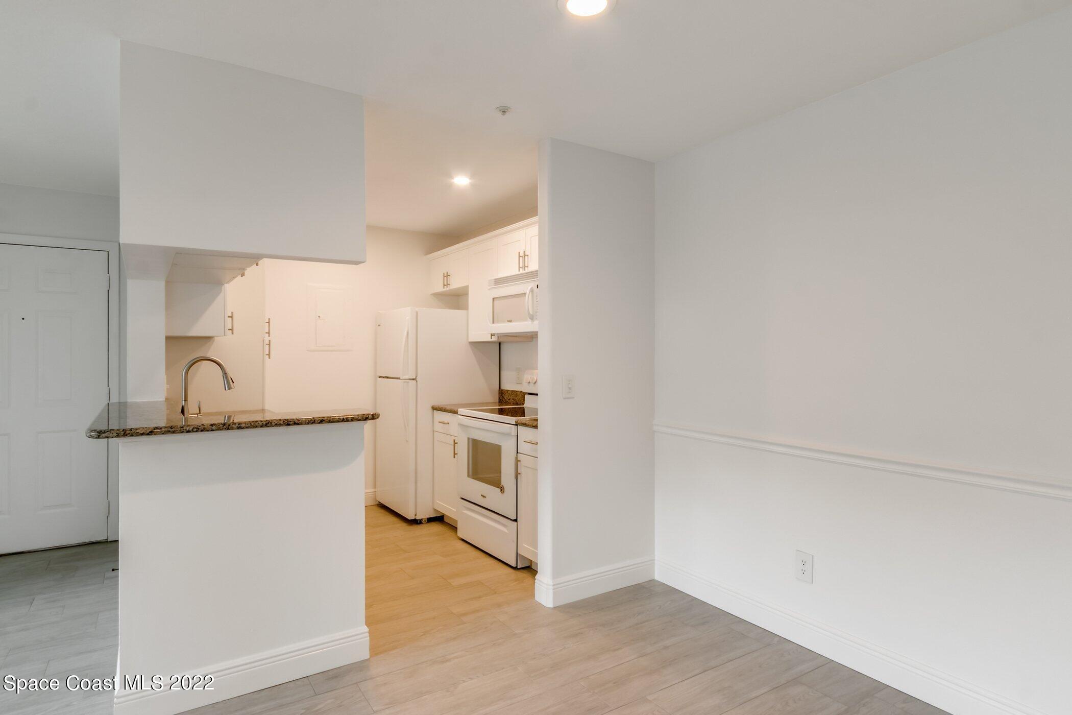 7667 North Wickham Road, Unit 703 Melbourne, FL 32940 - Photo 13 of 40 a view of a kitchen with a sink