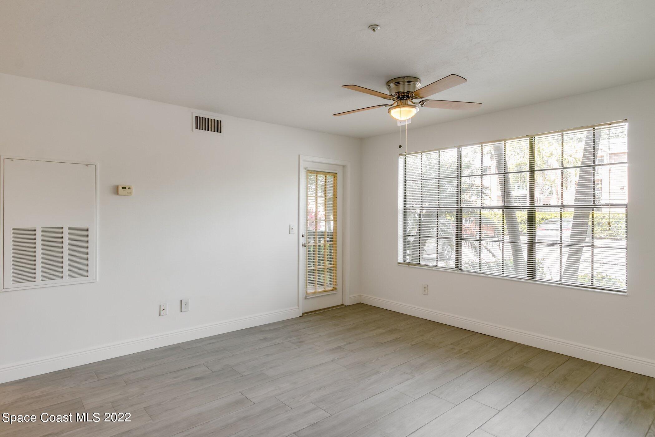 7667 North Wickham Road, Unit 703 Melbourne, FL 32940 - Photo 10 of 40 a view of an empty room with a window