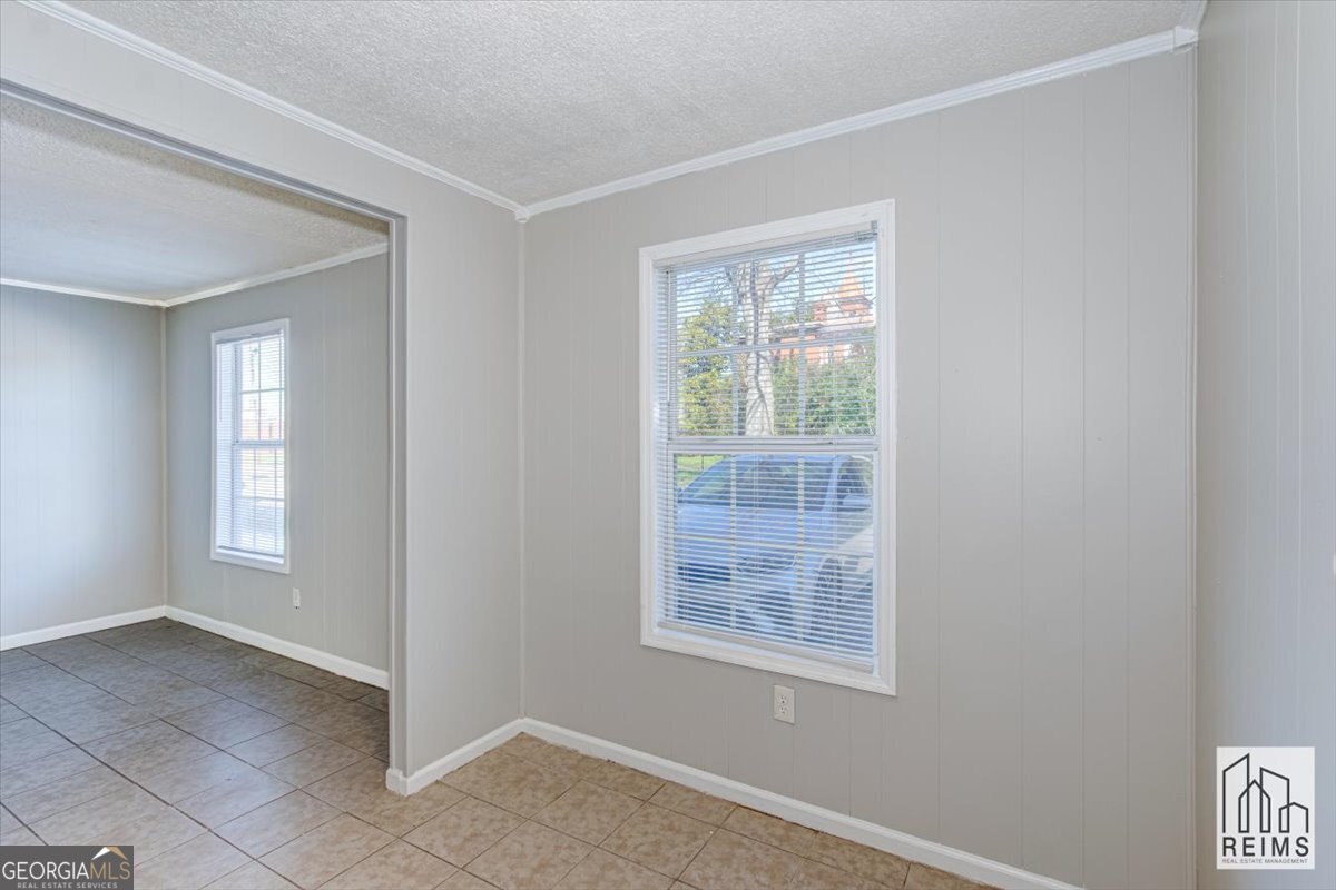 1232 12th Street, Unit D Augusta, GA 30901 - Photo 19 of 27 a view of an empty room with a window