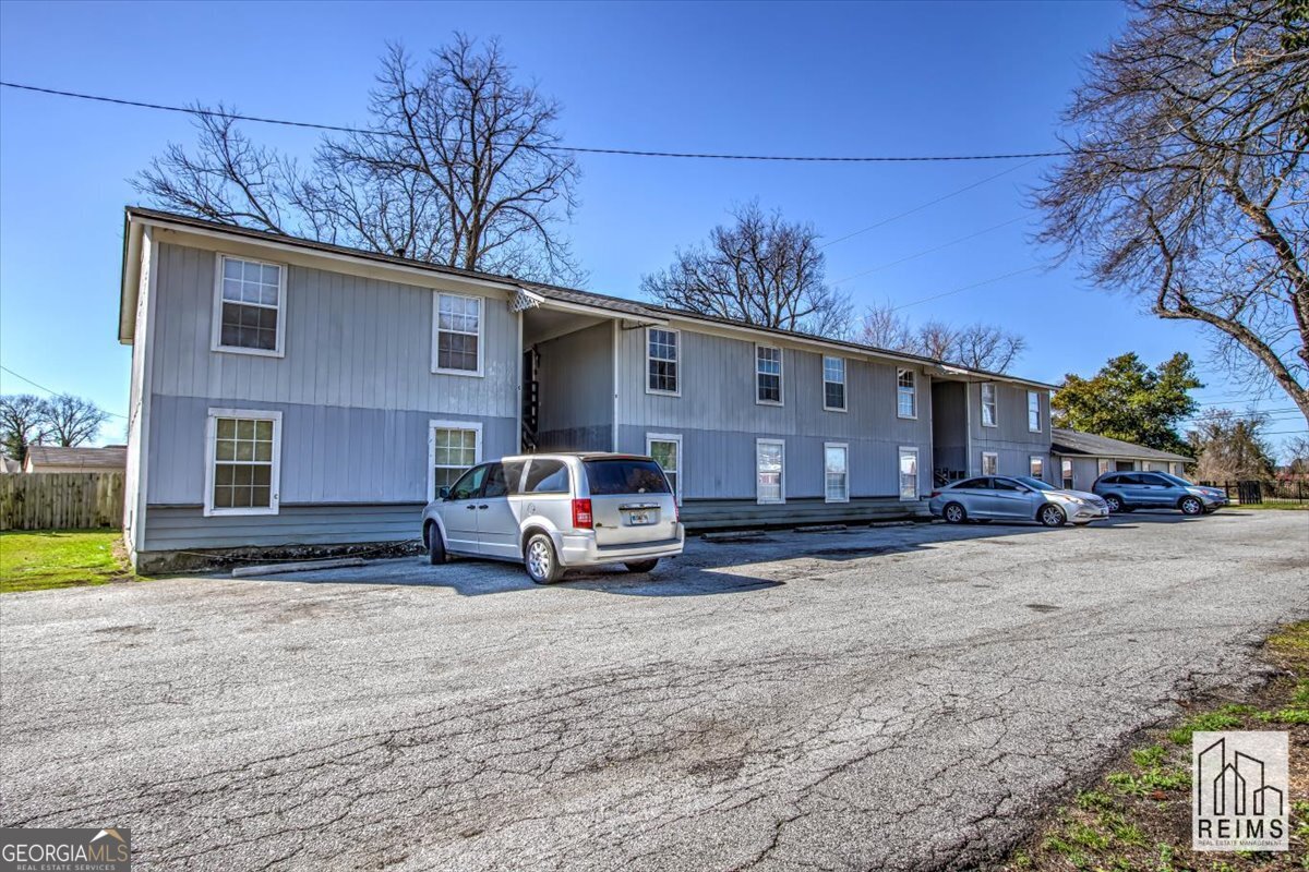 1232 12th Street, Unit D Augusta, GA 30901 - Photo 2 of 27 a car parked in front of a house
