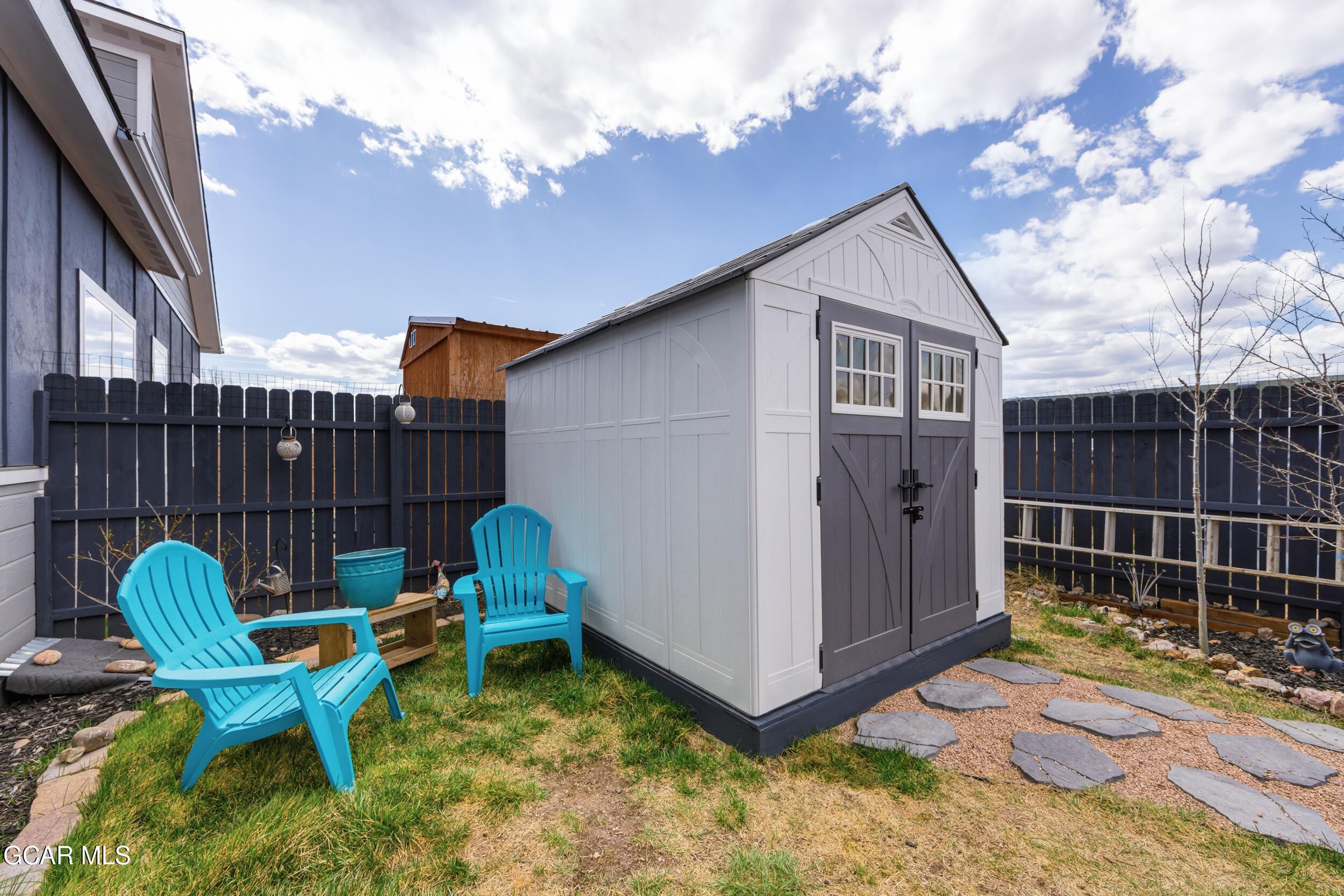 503 12th Street, Unit B Kremmling, CO 80459 - Photo 34 of 44 a backyard of a house with table and chairs