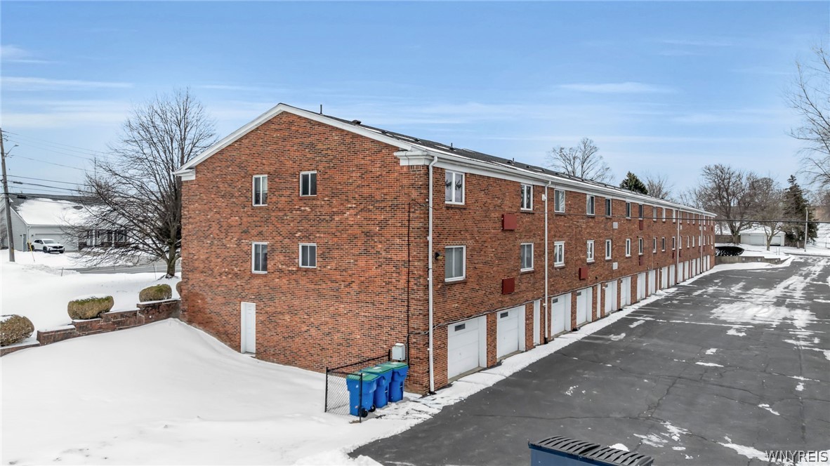 335 South Cayuga Road, Unit B Amherst, NY 14221 - Photo 26 of 30 Back of building with garages