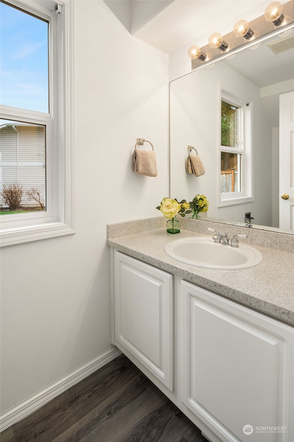 4801 Northeast 18th Place, Unit B Renton, WA 98059 - Photo 15 of 36 a bathroom with a sink and a mirror