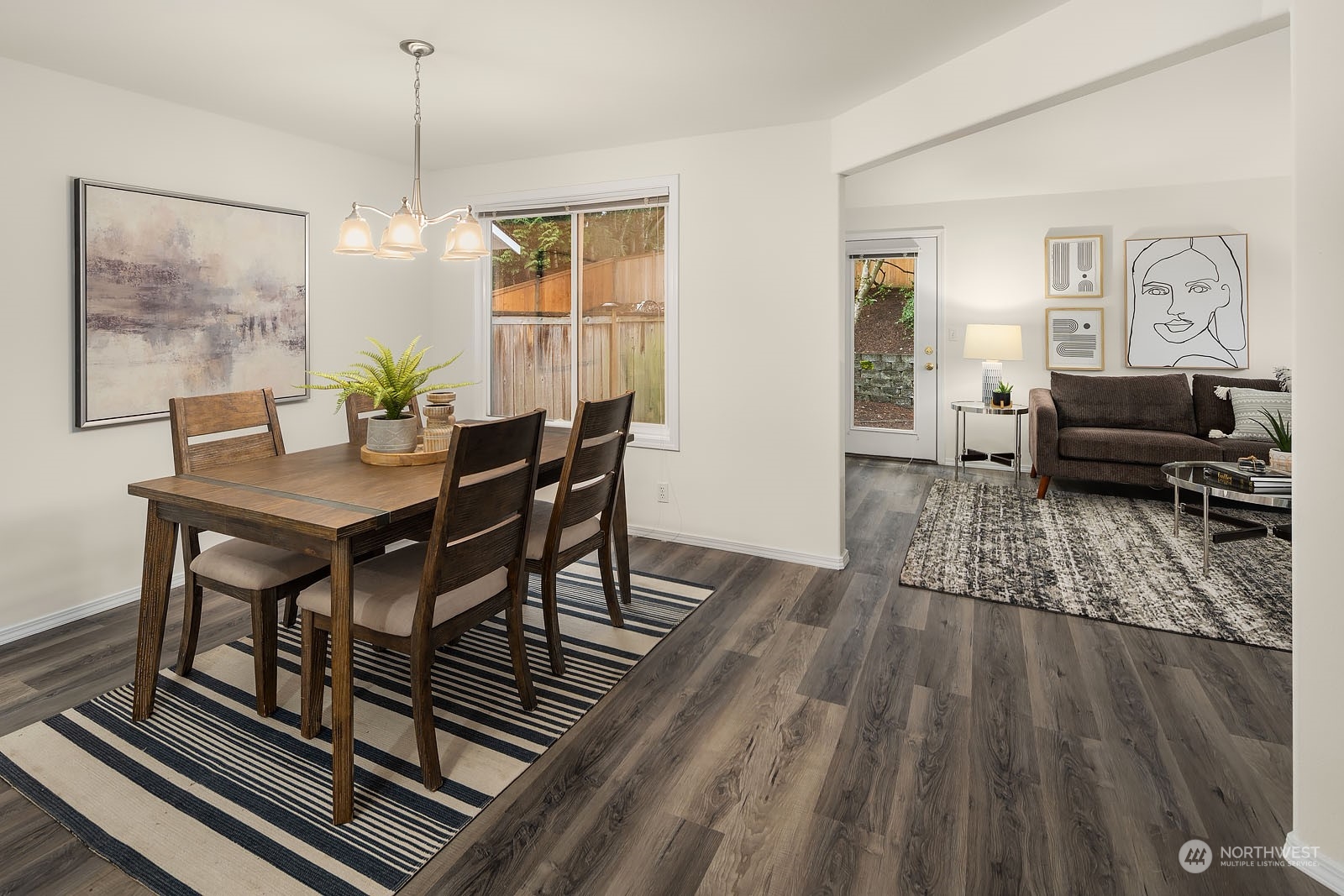 4801 Northeast 18th Place, Unit B Renton, WA 98059 - Photo 17 of 36 a view of a dining room with furniture window and wooden floor