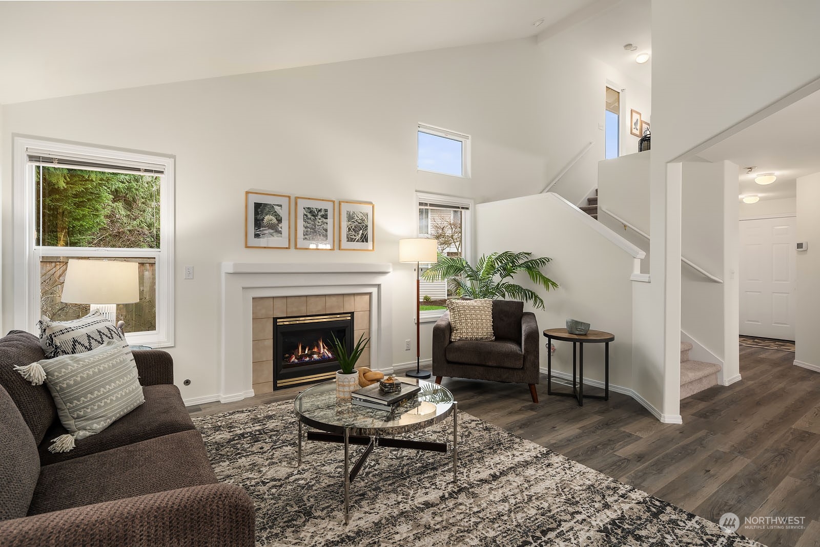 4801 Northeast 18th Place, Unit B Renton, WA 98059 - Photo 18 of 36 a living room with furniture and a fireplace