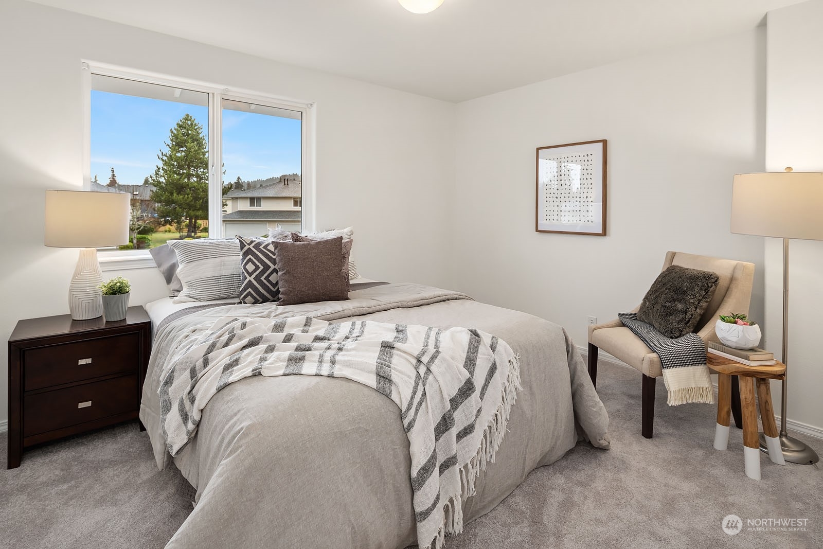4801 Northeast 18th Place, Unit B Renton, WA 98059 - Photo 24 of 36 a bedroom with a bed and a lamp on dresser