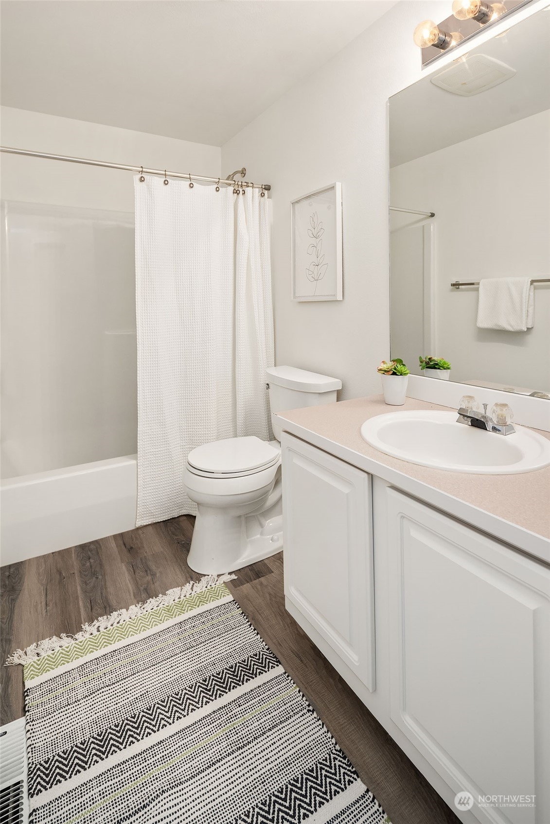 4801 Northeast 18th Place, Unit B Renton, WA 98059 - Photo 25 of 36 a bathroom with a sink toilet and shower