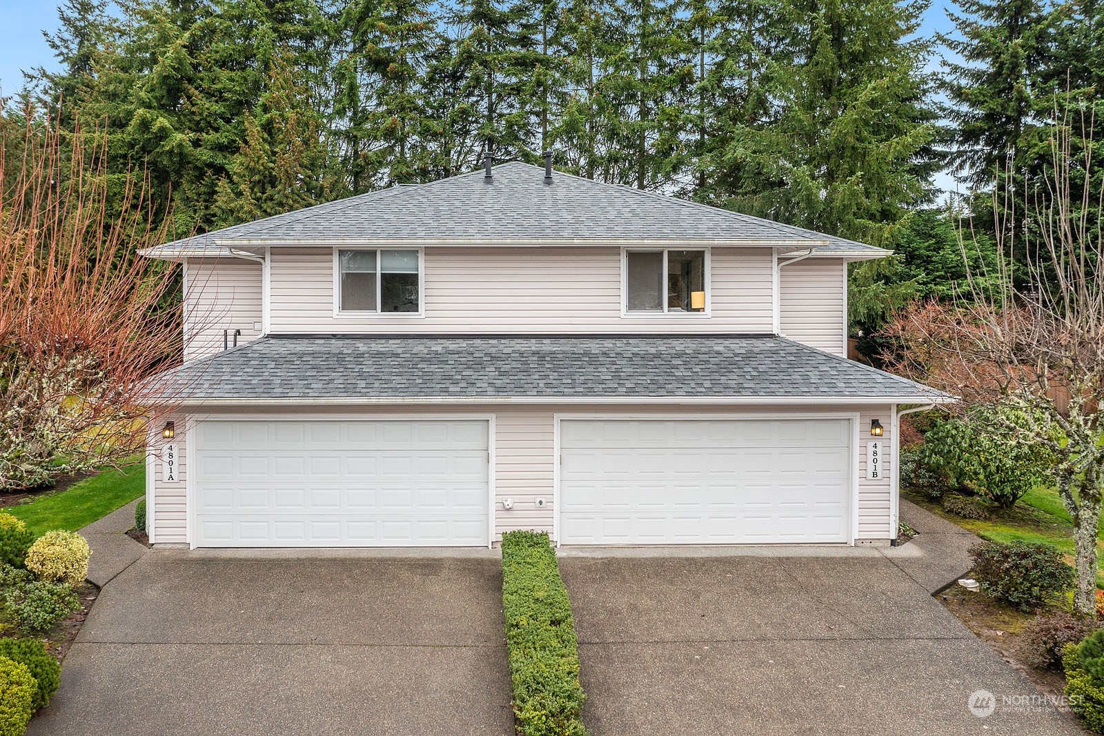4801 Northeast 18th Place, Unit B Renton, WA 98059 - Photo 29 of 36 a front view of a house with a garage