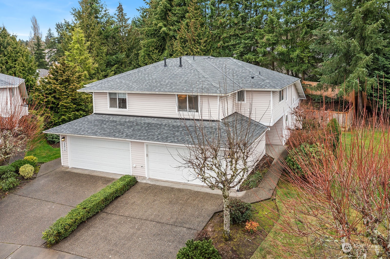 4801 Northeast 18th Place, Unit B Renton, WA 98059 - Photo 36 of 36 a front view of a house with a garden and tree
