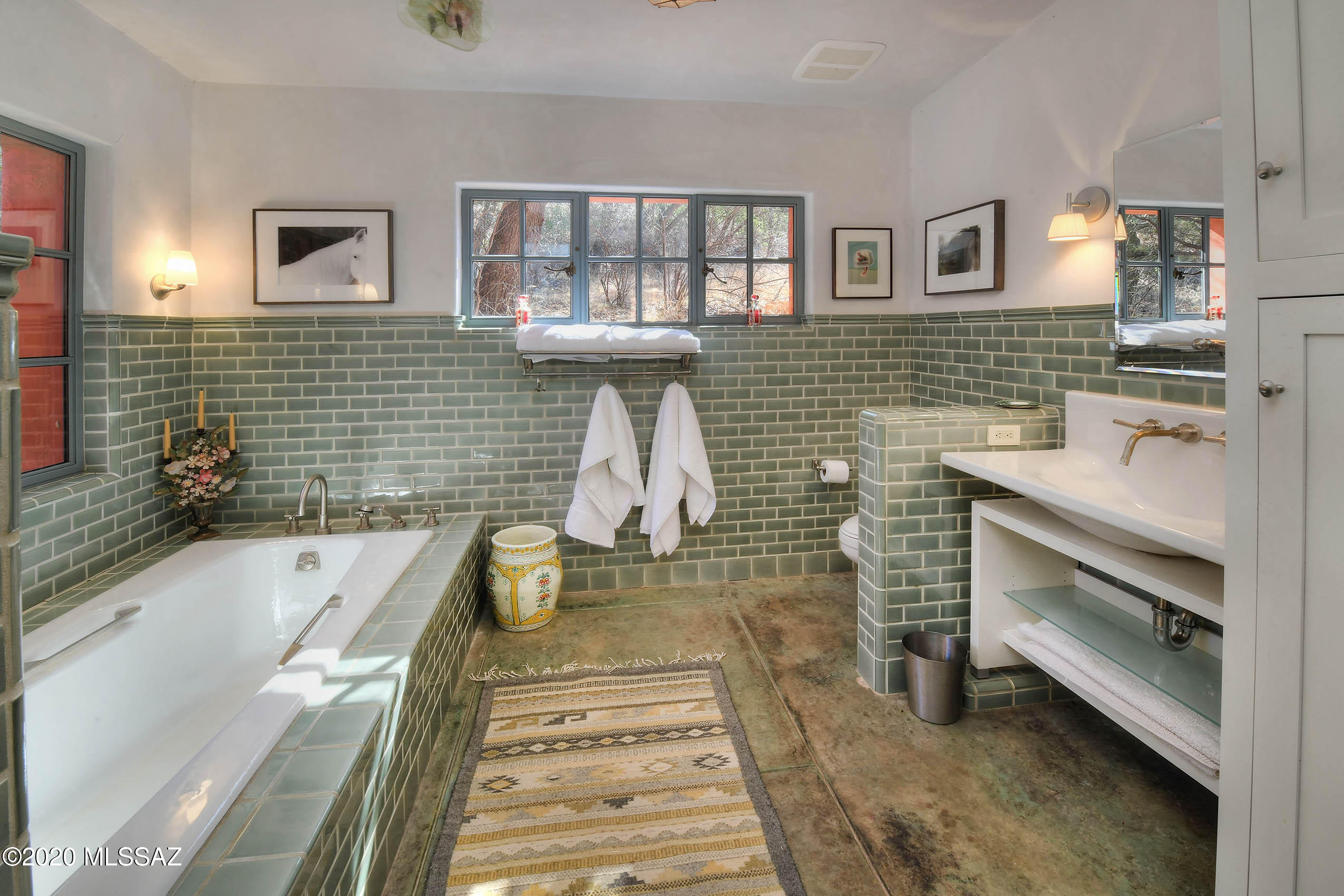 360 Harshaw Creek Road Patagonia, AZ 85624 - Photo 29 of 50 a bathroom with a bathtub sink and toilet