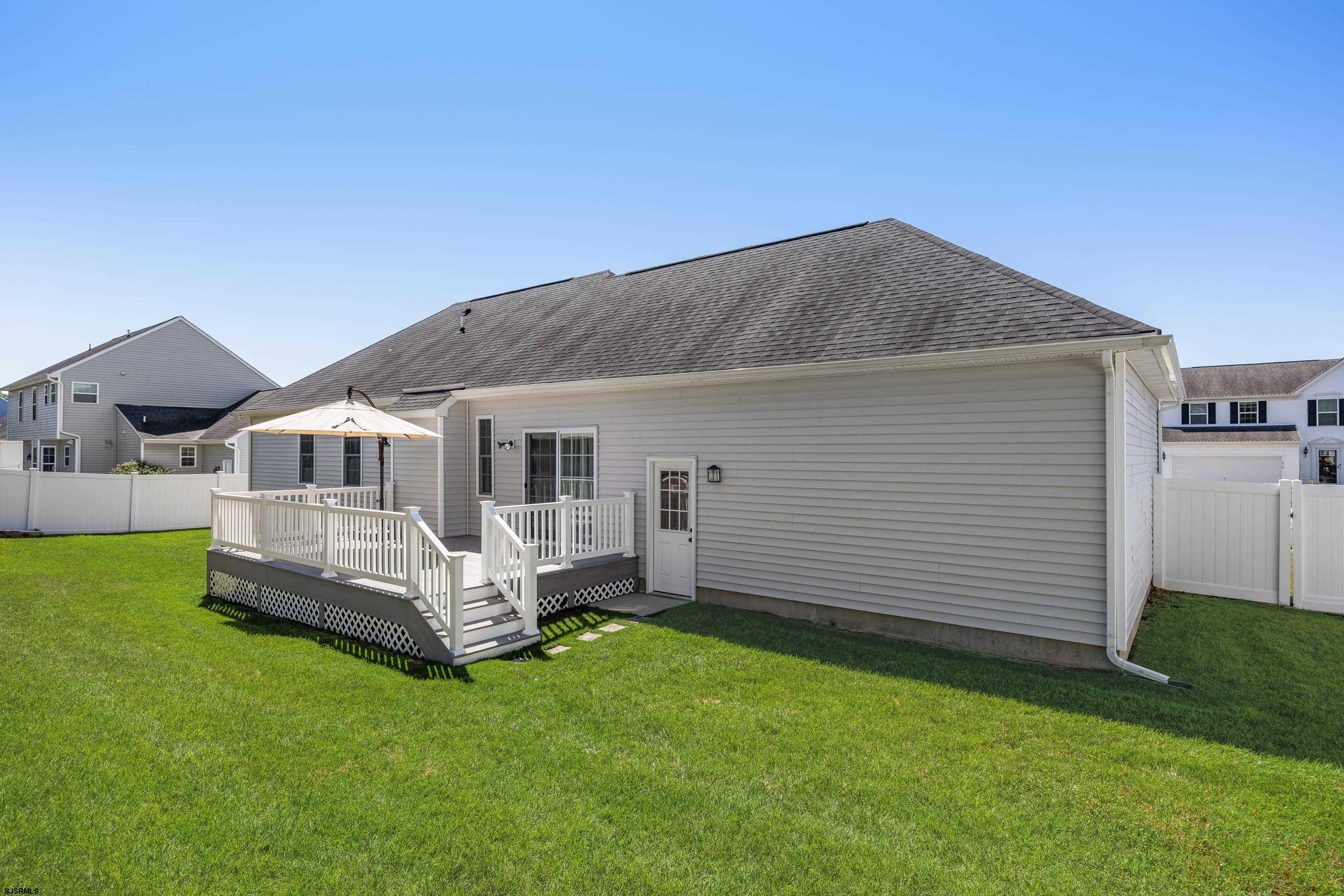 215 Surf Road Egg Harbor Township, NJ 08234 - Photo 24 of 31 a front view of a house with a garden