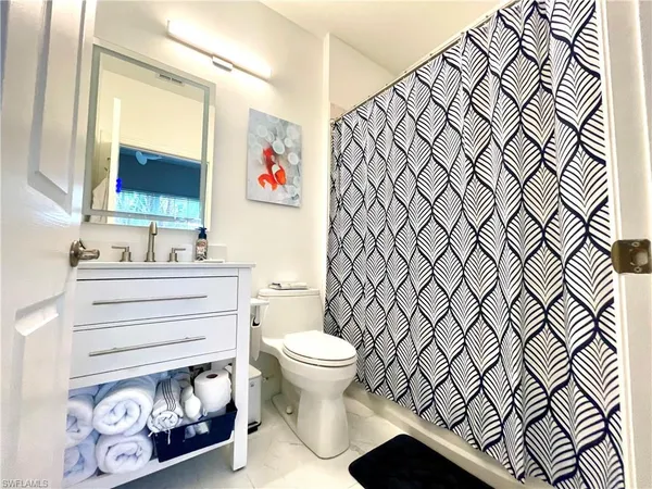 a bathroom with a toilet and a sink