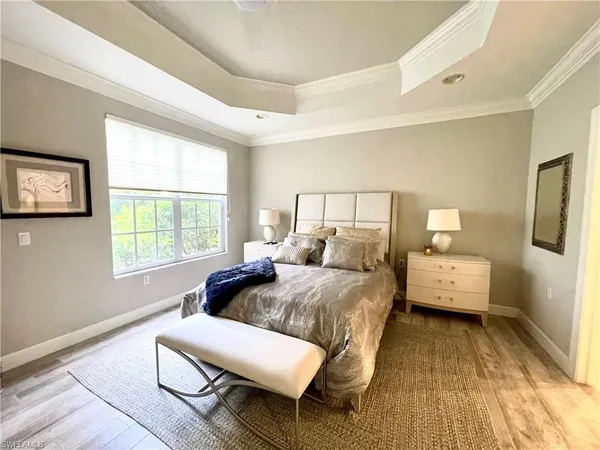a bedroom with a bed and a couch