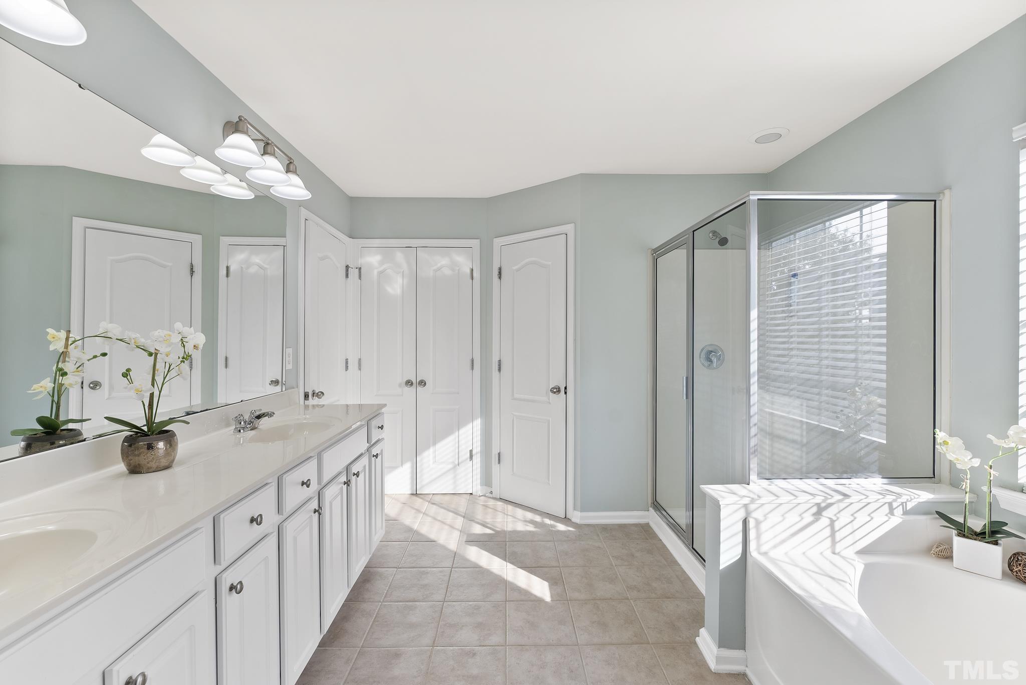 3306 Colorcott Street Raleigh, NC 27614 - Photo 19 of 42 a spacious bathroom with a double vanity sink mirror and double