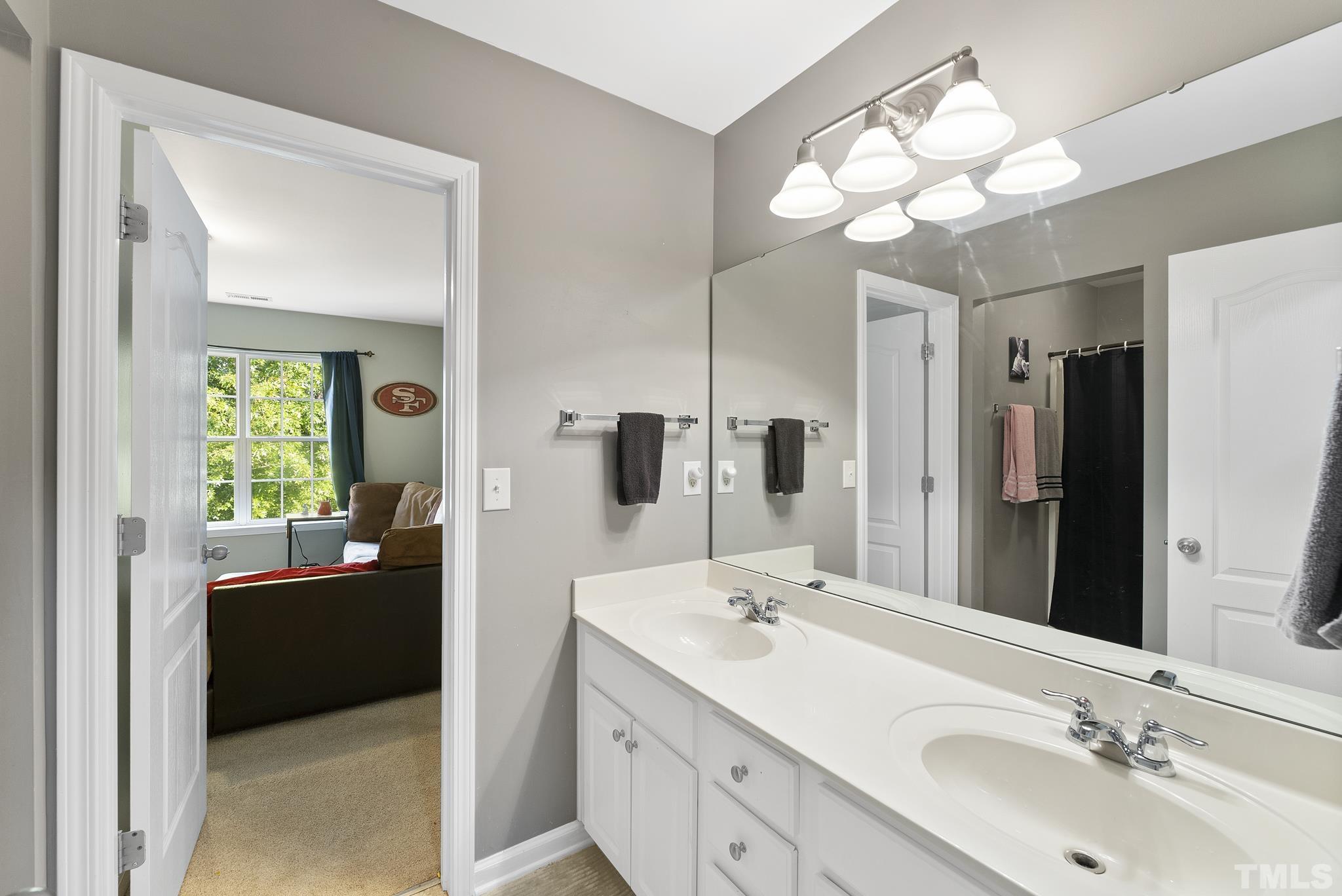 3306 Colorcott Street Raleigh, NC 27614 - Photo 27 of 42 a bathroom with a sink double vanity and a mirror