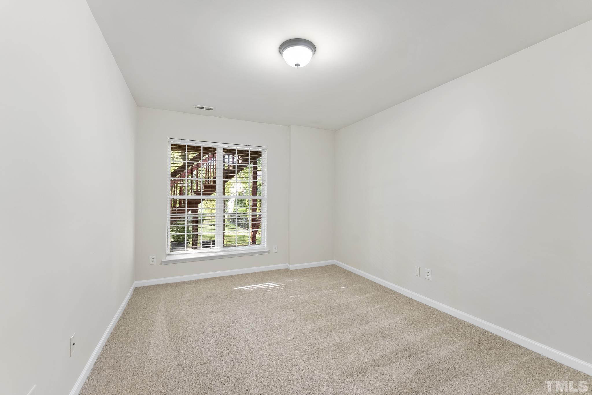 3306 Colorcott Street Raleigh, NC 27614 - Photo 36 of 42 an empty room with a window