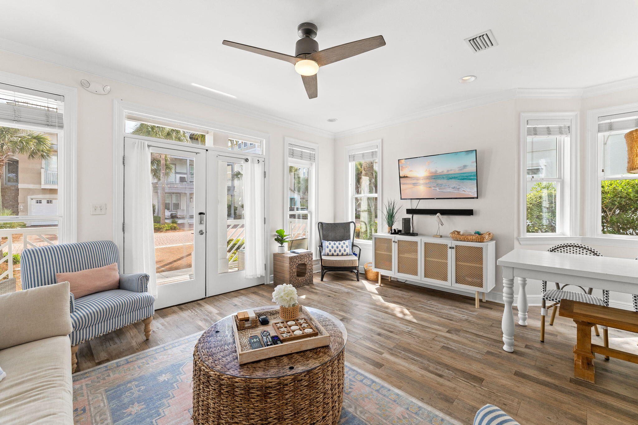 61 West Seacrest Beach Blvd Inlet Beach Inlet Beach, FL 32461 - Photo 1 of 47 a living room with furniture flat screen tv and window