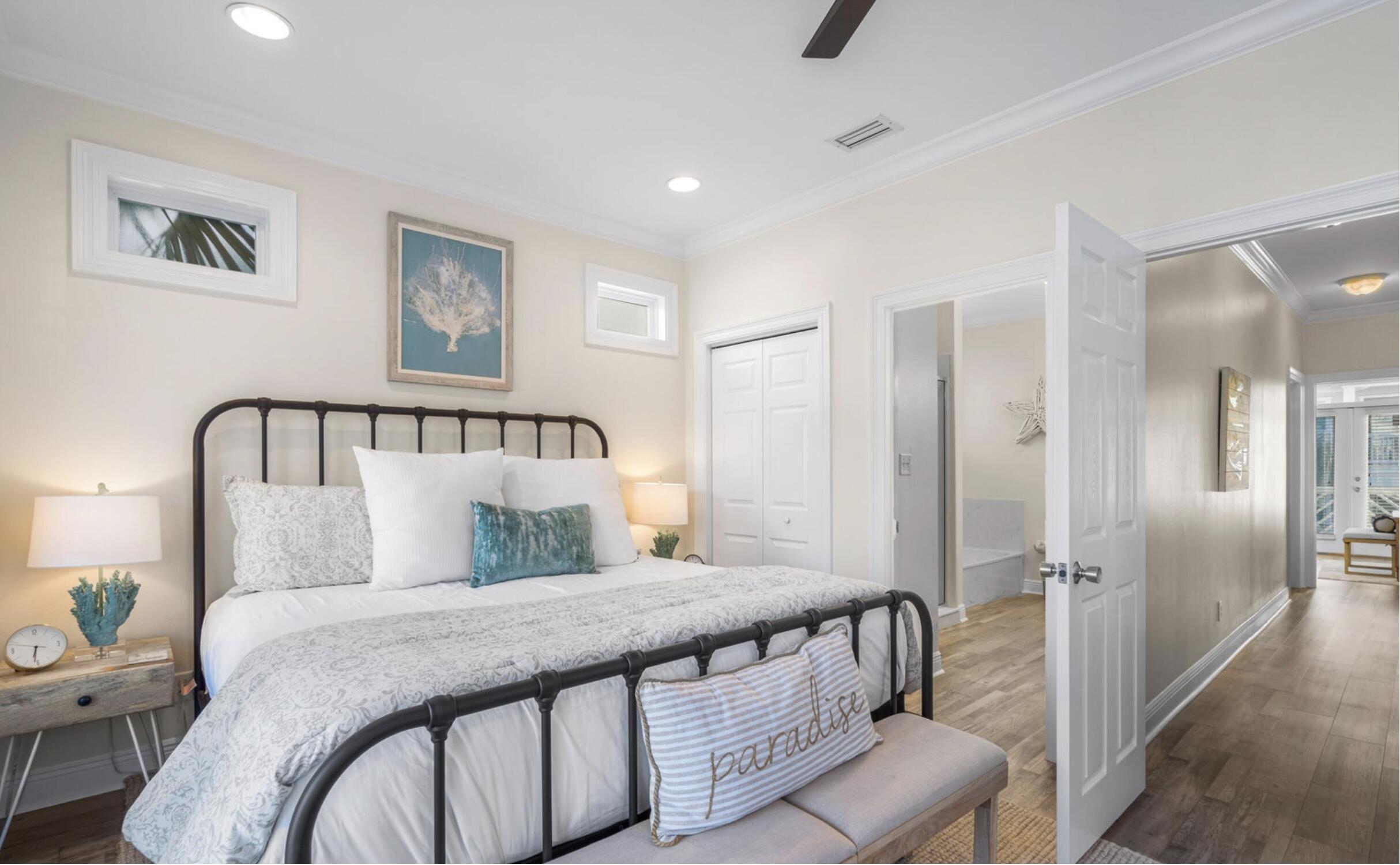 61 West Seacrest Beach Blvd Inlet Beach Inlet Beach, FL 32461 - Photo 12 of 47 a bedroom with a bed and a chandelier